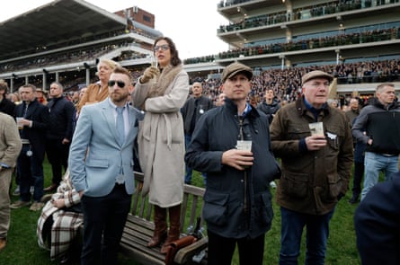Spectators watch the third race at Cheltenham