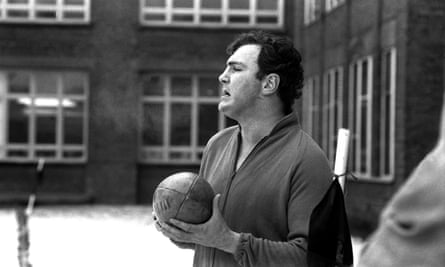 Tony O’Reilly holds a rugby ball.