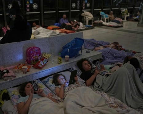 People bed down in a metro station in Ramat Gan, near Tel Aviv, Israel.