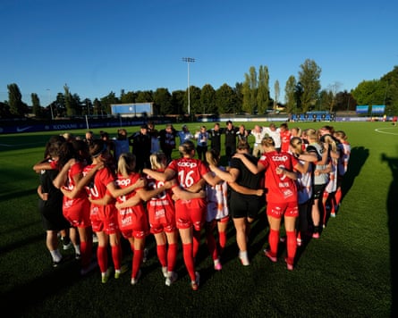 Brann players successful a huddle.