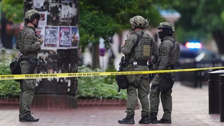 Law enforcement officials investigate after an attack on the Pearl Street Mall on Sunday in Boulder, Colorado.