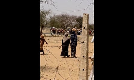 Screengrab from video said to show people fleeing the Zamzam camp with their belongings strapped to camels and donkeys