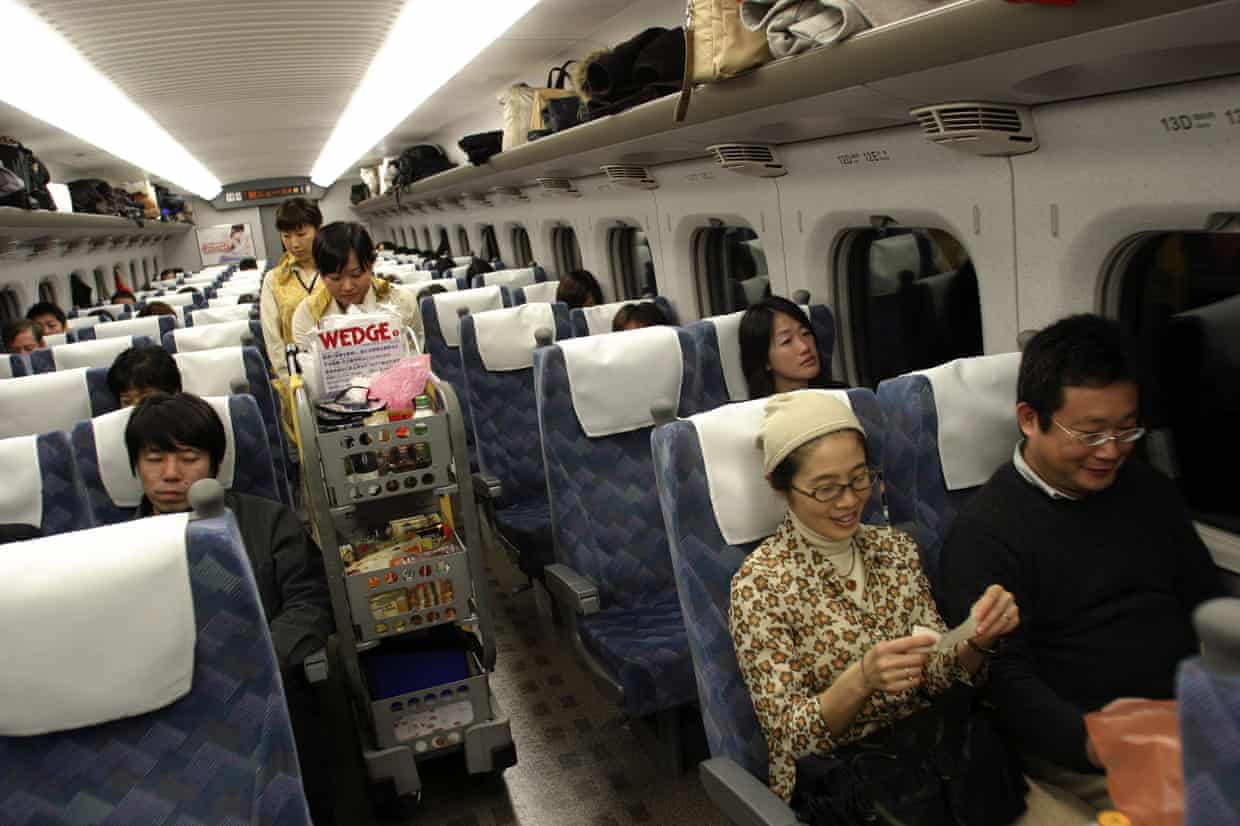 The food trolley and passengers in the interior of a shinkansen bullet train in Japan. The carts have become a popular after being discontinued on a Tokyo-Osaka route. Photograph: Jeremy Sutton-Hibbert/Alamy