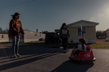Maria Celios, 32, plays outside at the Sussex Manor mobile home park with her son and daughter.