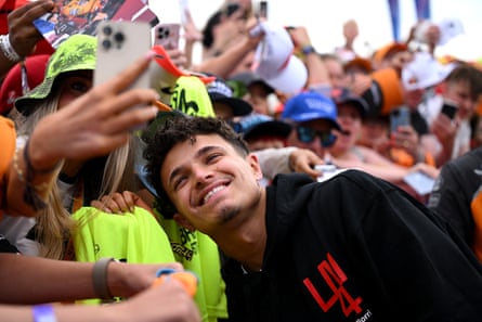 A fan takes a selfie with McLaren’s Lando Norris ahead of practice at Silverstone.