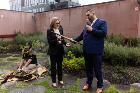 Victorian premier Jacinta Allan (right) receives a message stick from Commissioner Travis Lovett during a smoking ceremony ahead of the Yoorrook Justice Commission hearing in Melbourne on Monday.