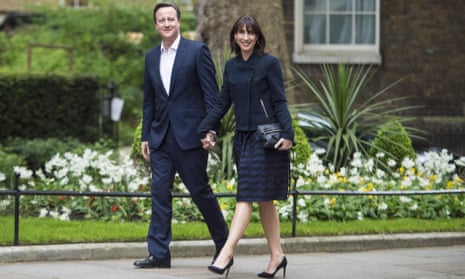 David Cameron and wife Samantha arrive back at Downing Street on Friday morning.