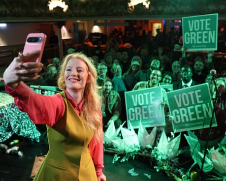 Hannah Spencer takes a selfie in front of Green supporters