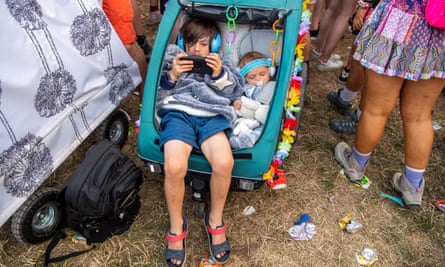 Happy little campers: Glastonbury ready to welcome more children than ever | Glastonbury 2023 2 Chilling out in the pram.