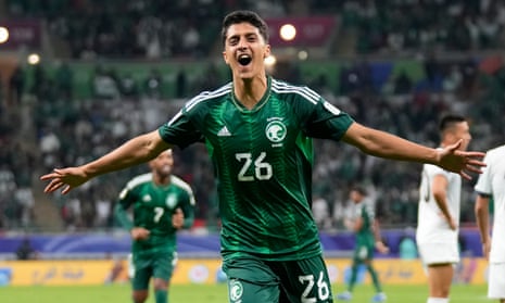 Faisal Al-Ghamdi celebrates after scoring Saudi Arabia’s second goal late in the game.