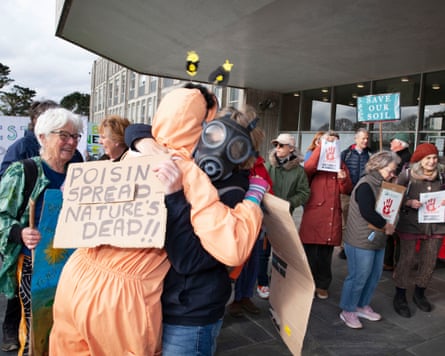 Nichola Andersen and Lesley Fitt embrace during the protest