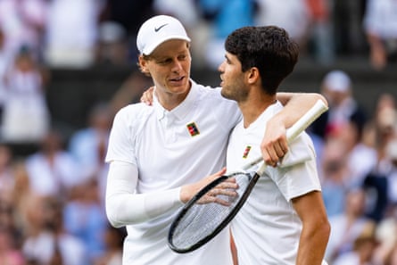 Jannik Sinner and Carlos Alcaraz share a hug after the Wimbledon final.