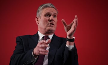 Keir Starmer is mid-speech, gesticulating with his hands.