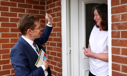 Andy Street talks to woman at her front door