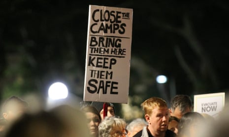 Sign reading 'Close the camps - bring them here - keep them safe' at a rally calling for closure of detention centres, Sydney, Australia - 19 Jul 2017