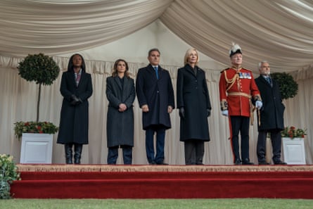 The characters stand side by side on a raised platform