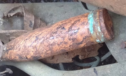 This undated photo released by the Malaysian Maritime Enforcement Agency (MMEA) shows scrap metal and an old cannon shell on a Chinese-registered vessel after it was detained in the waters of east Johor