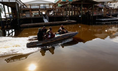 Four rescue volunteers on a boat in Keaton Beach,