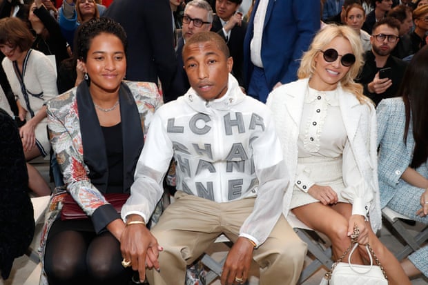 Pharrell Williams with his wife, Helen Lasichanh, left, and Pamela Anderson on the front row.