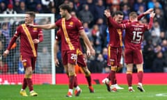 Motherwell players celebrate after Dan Casey scored their decisive second at Rangers.