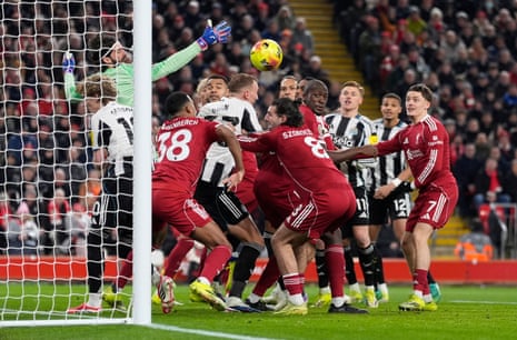 Liverpool goalkeeper Alisson Becker attempts to stop a Newcastle corner