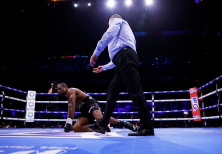 The referee Howard Foster counts out Daniel Dubois as he kneels during his fight against Fabio Wardley