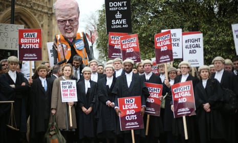 Barristers and solicitors demonstrate outside parliament against cuts to legal aid in March 2014.