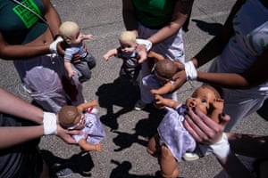 Virginia, US: Abortion rights activists with Rise Up 4 Abortion Rights hold baby dolls in Falls Church, Virginia. According to the group, the dolls represent forced births. Abortion rights protests at the homes of conservative justices have become common since a leaked draft decision indicated the court may overturn Roe v Wade