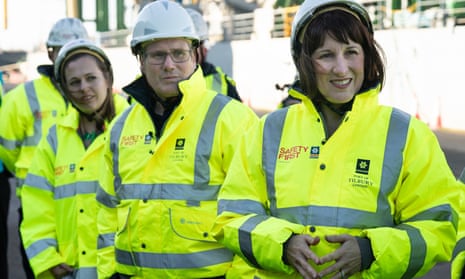 Keir Starmer and Rachel Reeves wearing protective gear while visiting Tilbury freeport