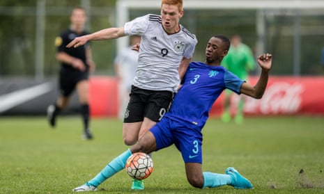 Melayro Bogarde tackles Germany’s David Hummel of Germany in an under-15 international in May.