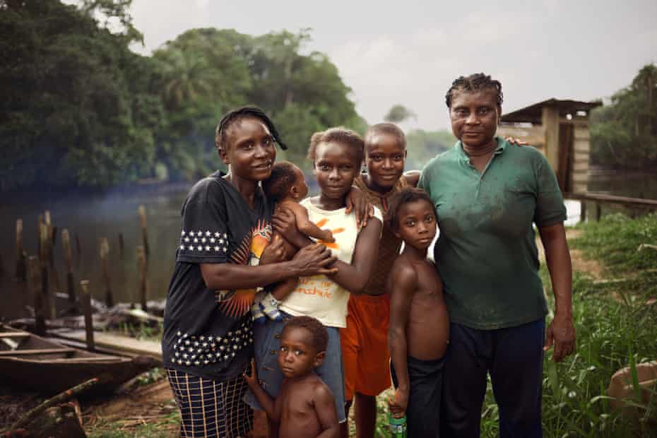 Pelepre Newton, fisher and farmer, with her family, Azuzuama community, Bayelsa, Nigeria, 2018
