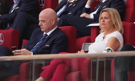 Germany’s interior minister, Nancy Faeser, with the OneLove armband beside Fifa’s president, Gianni Infantino