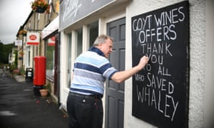 Malcolm Swets, manager of Goyt Wines, writes a thank you note on a board after police said it was safe for people to return.