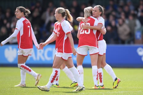 Alessia Russo of Arsenal celebrates scoring her team's first goal with teammate Katie McCabe.