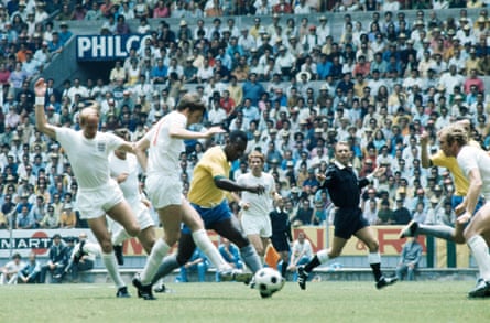 Brazil's Pelé causes problems for the England defense with Martin Peters trying to tackle, as Bobby Charlton (left), Alan Ball, referee Abraham Klein and Bobby Moore (right) look on during their match team of the 1970 world cup at the Jalisco stadium in Guadalajara.
