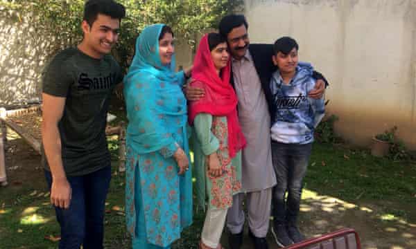 Yousafzai with her family members at her native home during a visit to Mingora in 2018.