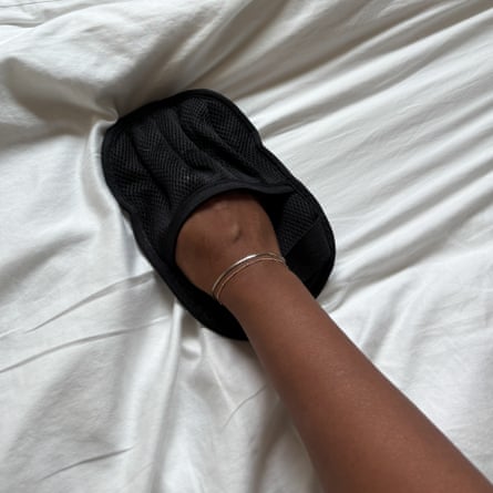 A Salhap Pet Hair Removal Glove removing cat hair