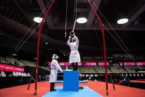 Kitakyushu, Japan: staff members disinfect the gymnastics rings
