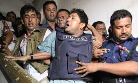 Sohel Rana, wearing a bulletproof vest, is taken by police to the courts in April 2013.