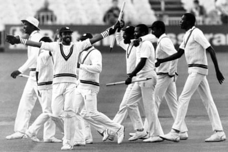 West Indies players celebrate after winning the third Test at Old Trafford.