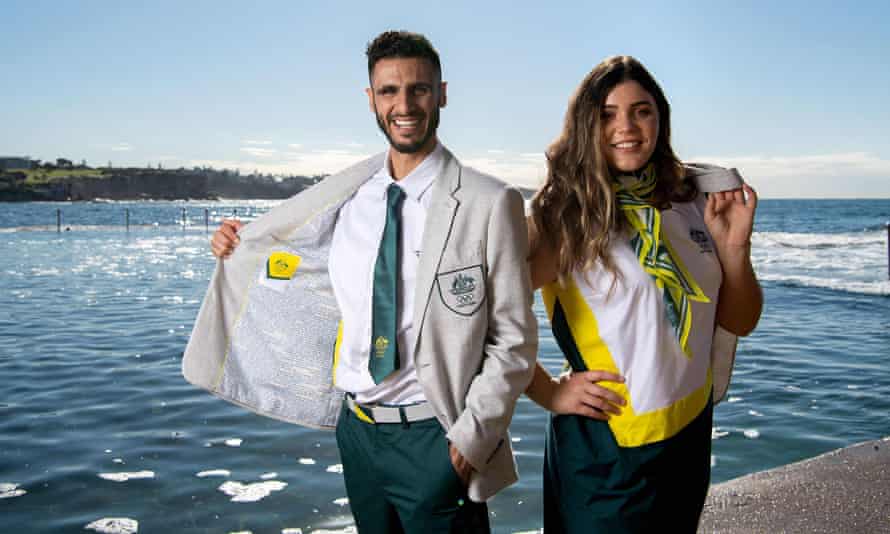 Australian taekwondo athlete Safwan Khalil (left) and softballer Tarni Stepto pose at the Australian Olympic team opening ceremony uniform unveiling at Wylie’s Baths in Sydney