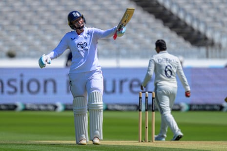 Sophie Ecclestone celebrates scoring 50 runs.
