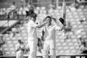 Mike Atherton congratulates his Lancashire teammate Neil Fairbrother on scoring a double century.