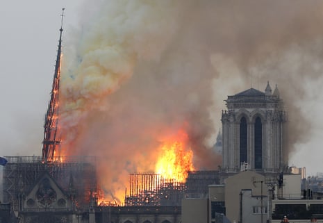 Flames rise from Notre Dame cathedral as it burns in Paris.