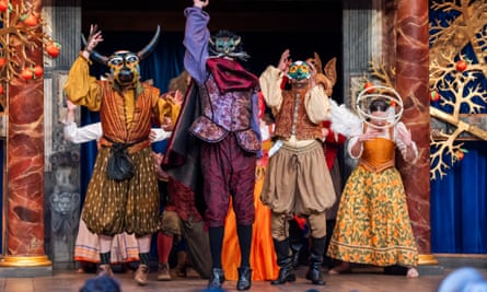 The cast masked on stage. 
