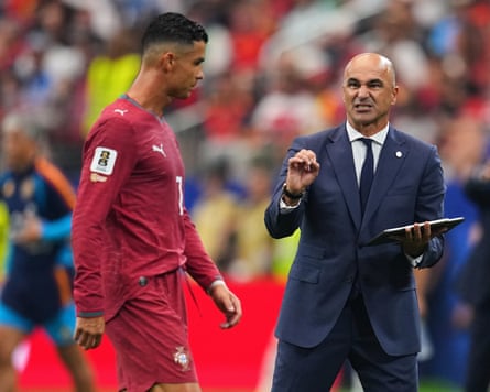 Roberto Martínez issues instructions to Cristiano Ronaldo during the game.