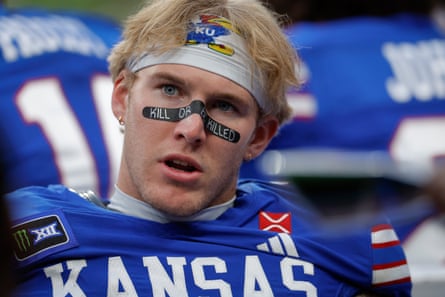 Kansas wide receiver Keaton Kubecka wearing the message “Kill or be killed” on a plaster over his nose.