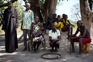 Mary (centre) with her family outside her home in Wulu, South Sudan, on Tuesday 1 May 2018.