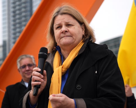 a woman holds a microphone