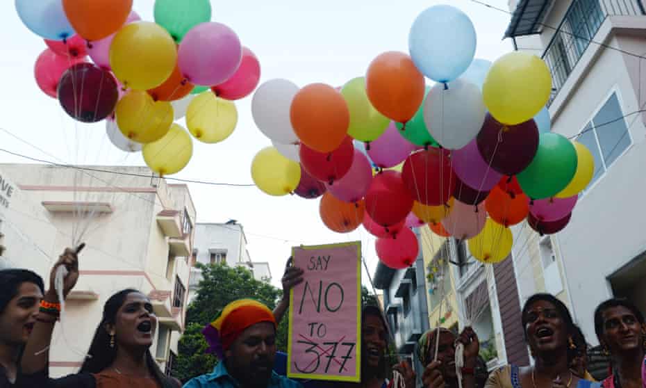 Indians with balloons and placards.